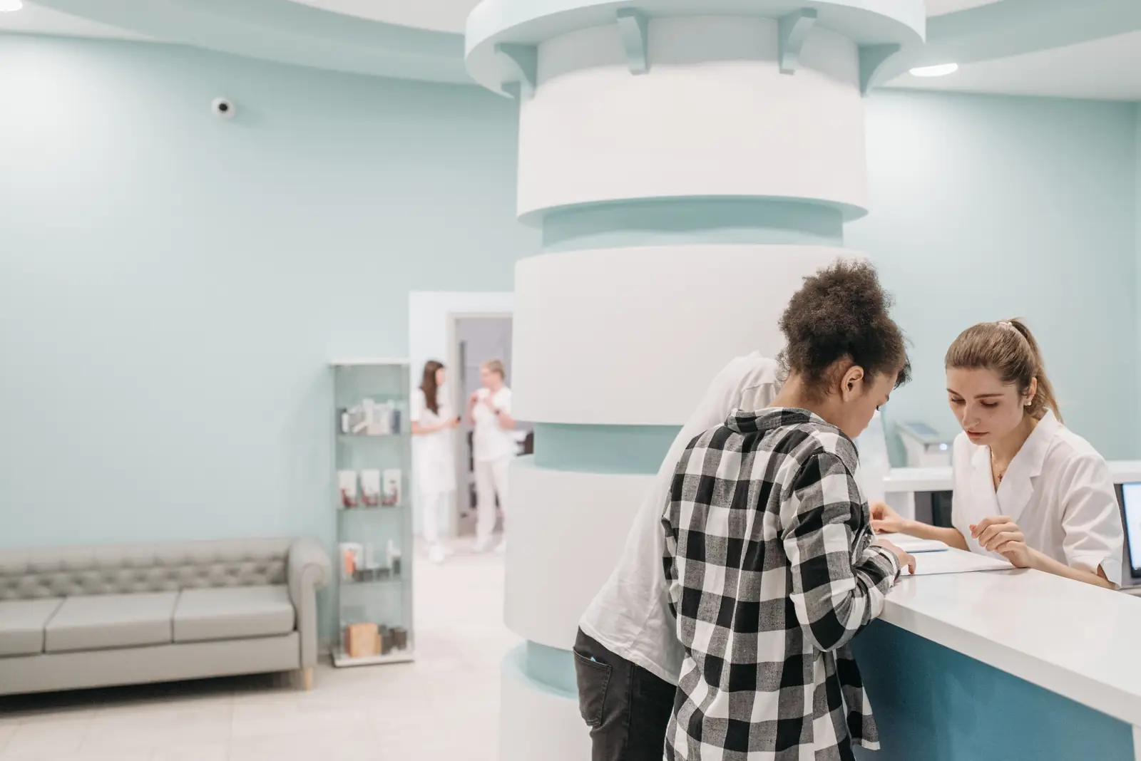 An organized clinic reception scene with staff and patients