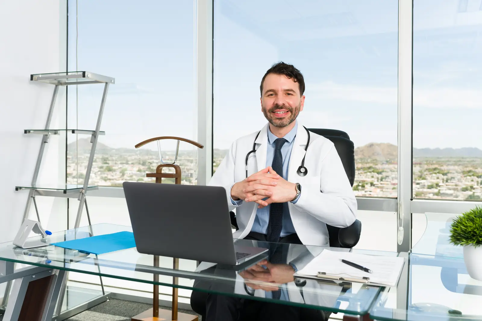 A confident doctor at his desk, in control of his clinic's day