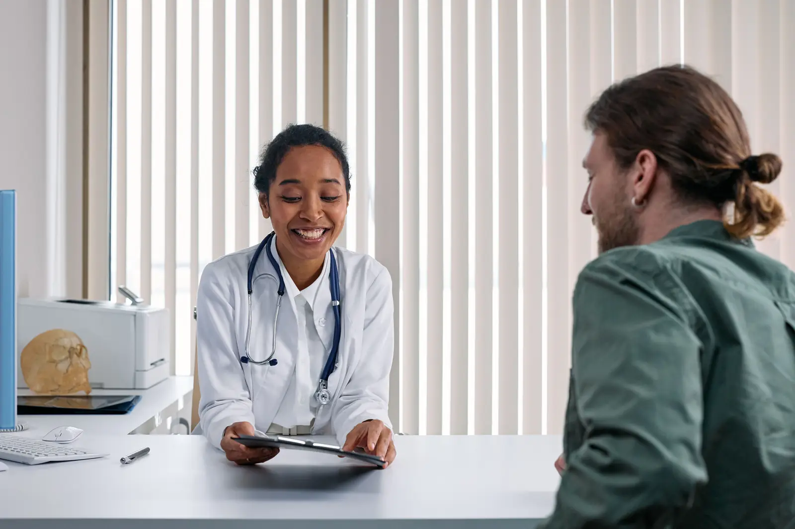 A doctor consulting with a patient in a modern clinic